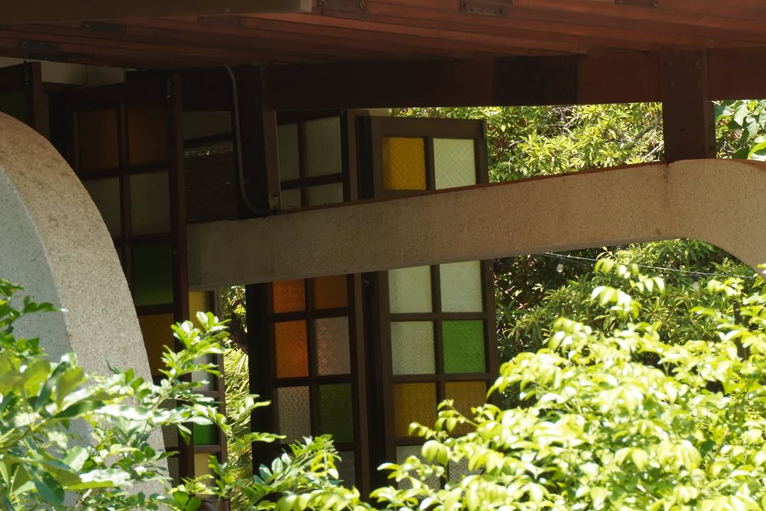 Colorful stained glass window panels on the facade