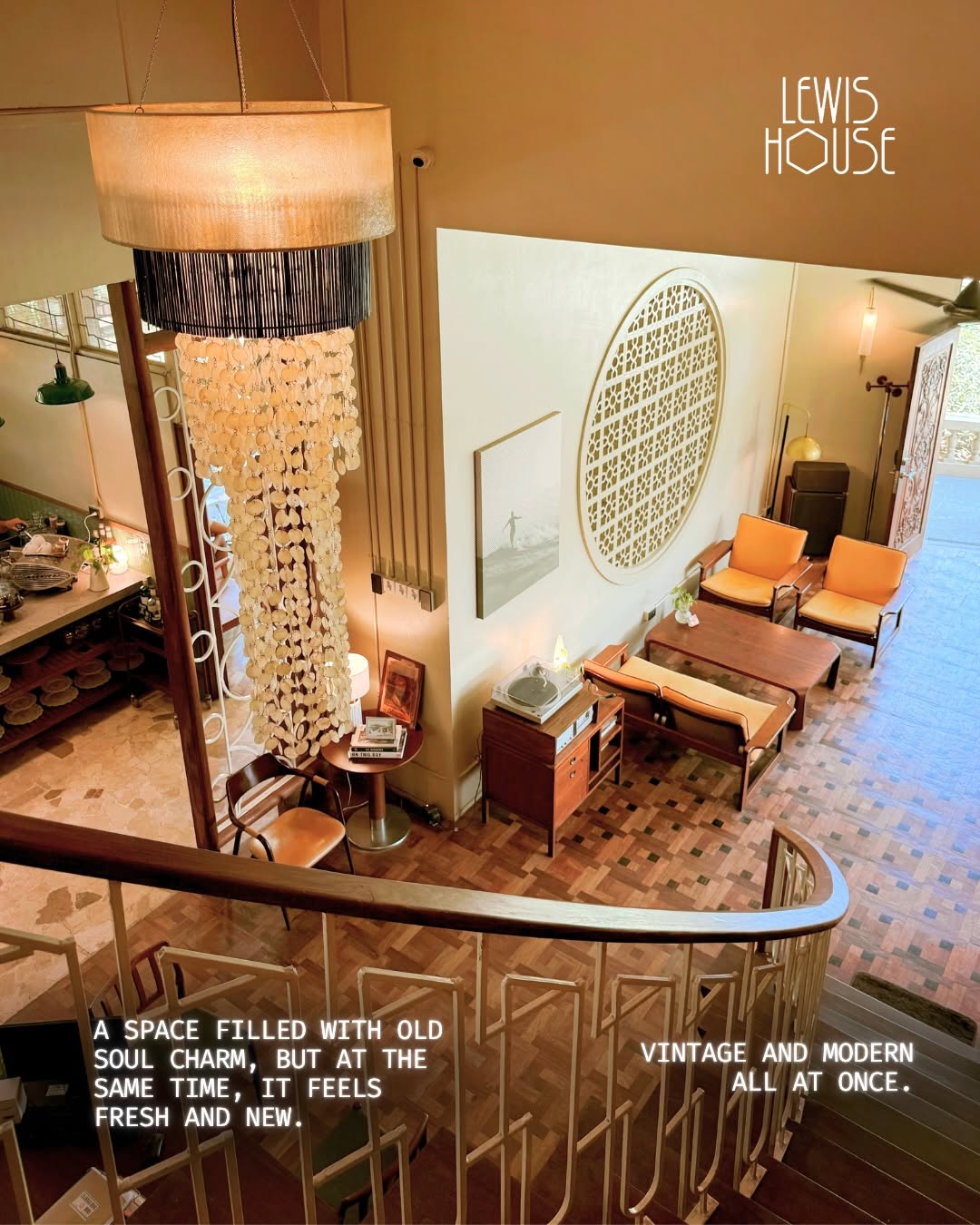 View from upper balcony into lobby — parquet floors and capiz chandelier